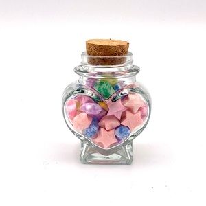 Origami glow in the dark stars in a heart jar